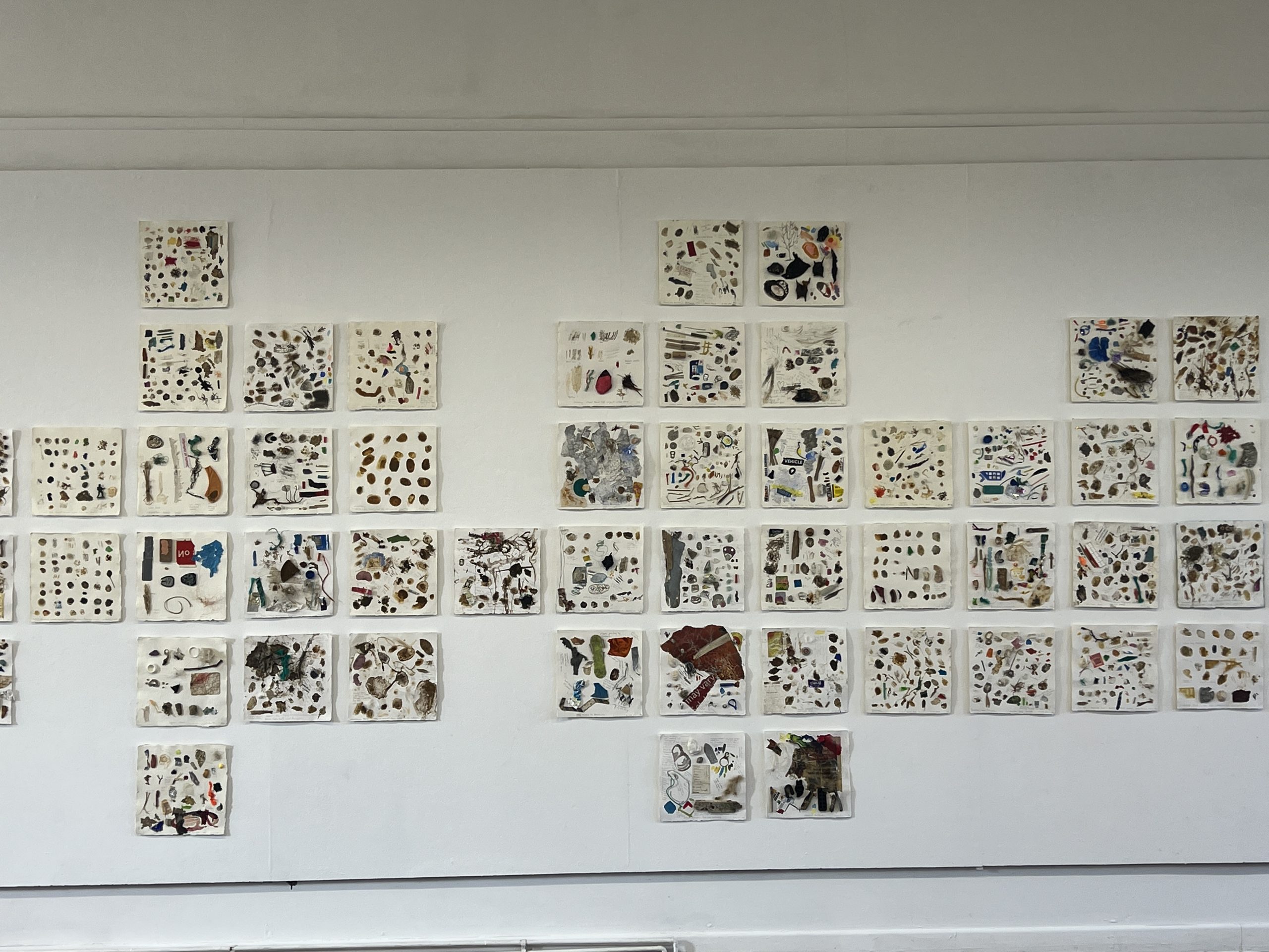 Place palettes — Twenty years of gathering, hung as one wall.